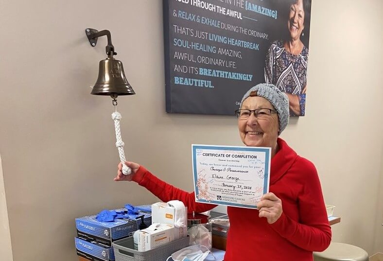My mom ringing the bell to celebrate as she finishes her treatment for breast cancer!